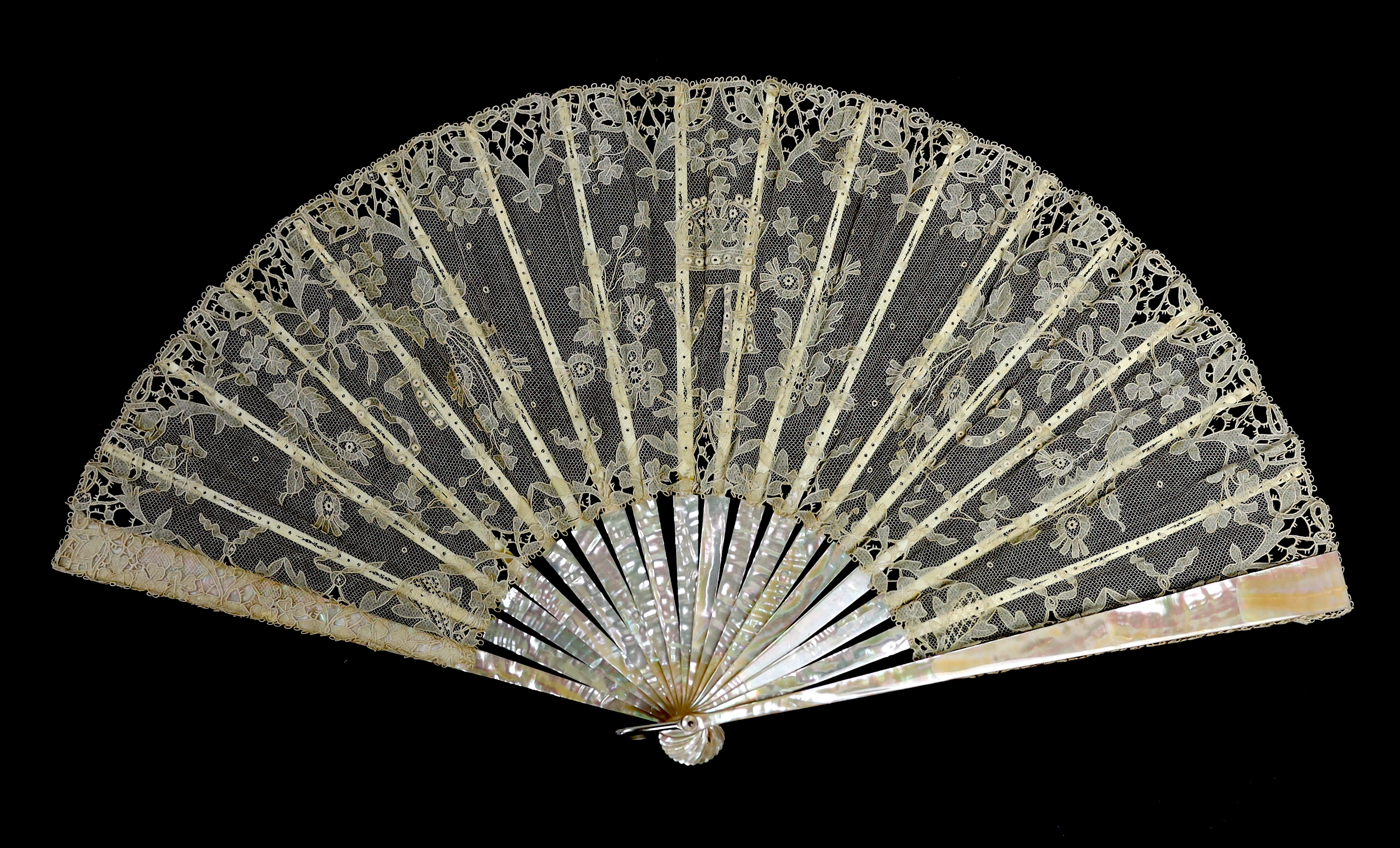 An unusual commemorative Carrickmacross lace fan, possibly one made and entered for a group of competitions held by the Worshipful Company of Fan Makers, the winning fan to be presented to Queen Victoria as a gift for he